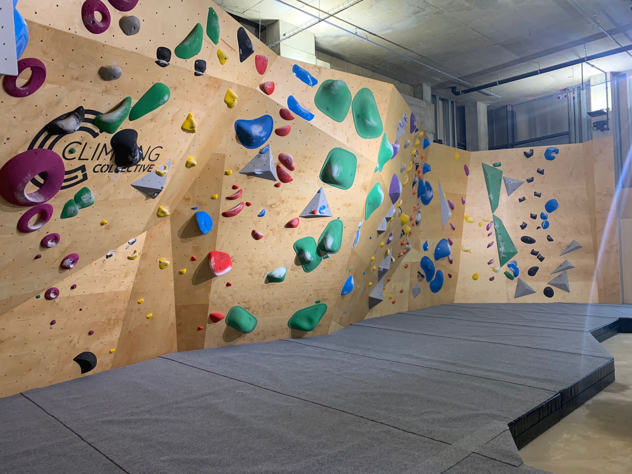 Finished competition style bouldering wall. Wood finish