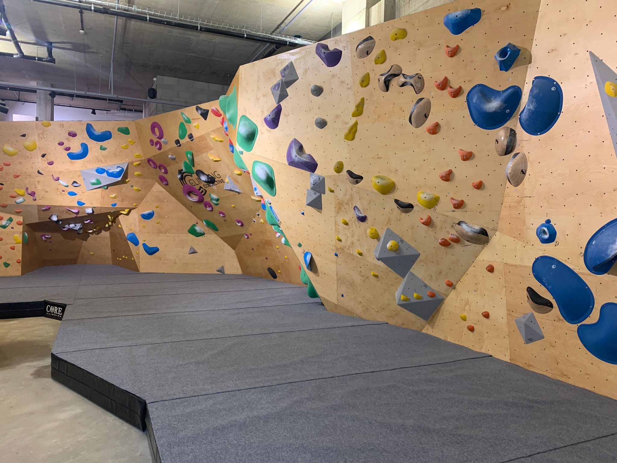 Finished competition style bouldering wall. Wood finish